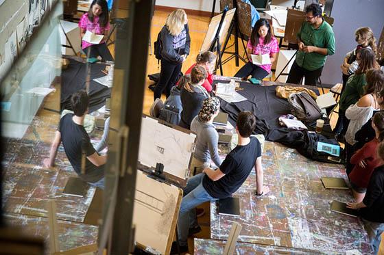 Photo from above of Chatham University students in an art class
